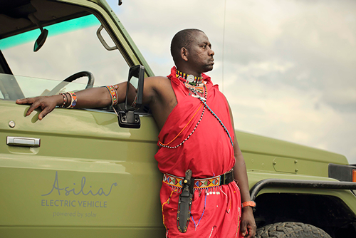 Asilia-Ol-Pejeta-Bush-Camp-Electric-Vehicle-and-Maasai-head-guide-Duma © Asilia Africa